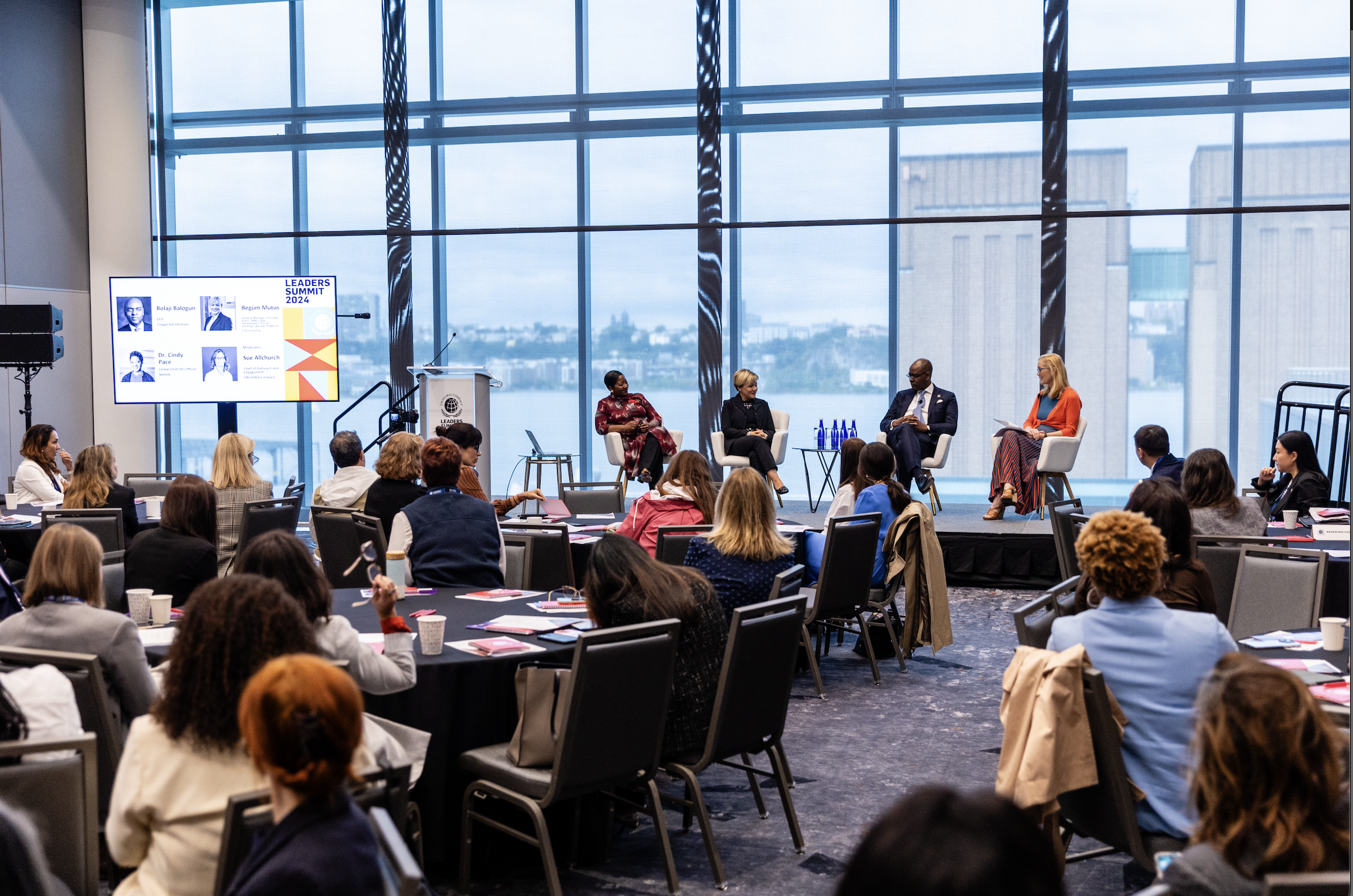 Image of speakers during a session at Leaders Summit with audience members