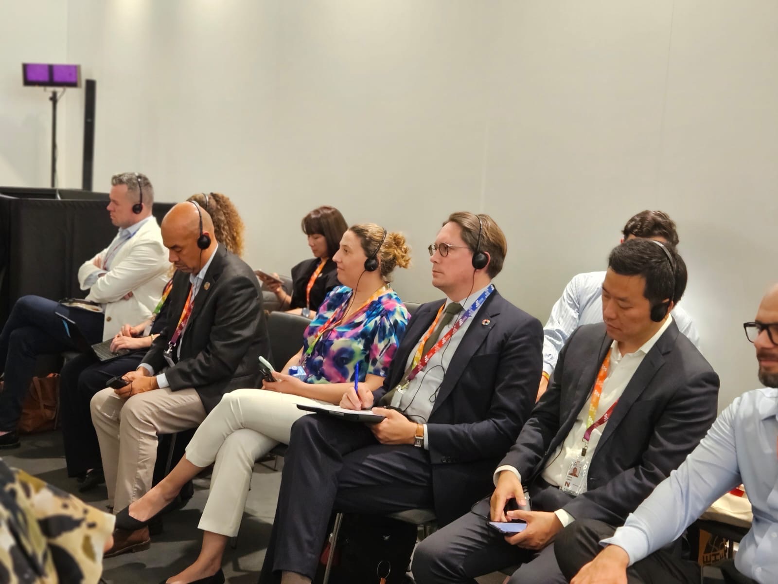 Financing for Development Conference participants listening to translation of discussions