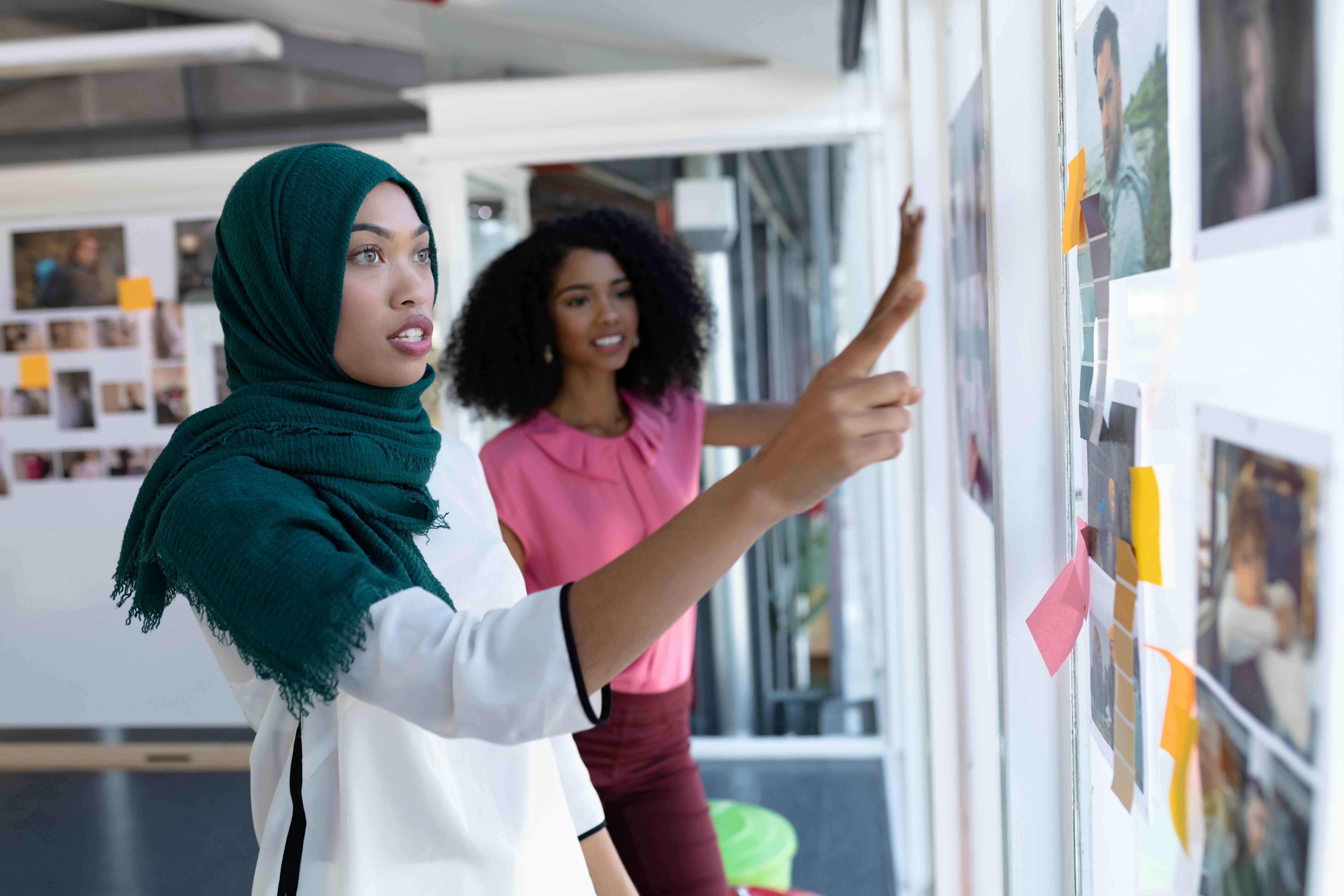 women working on a board