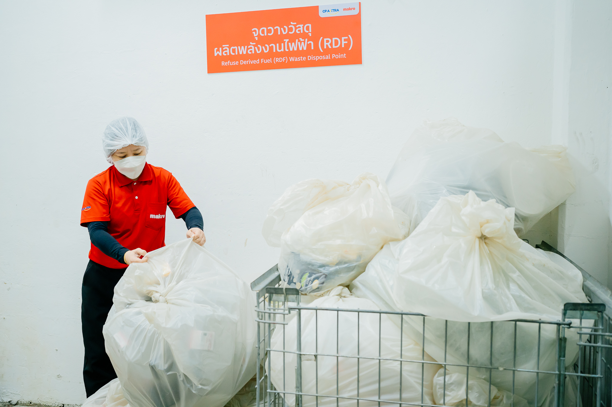 Worker drop a bag with waste