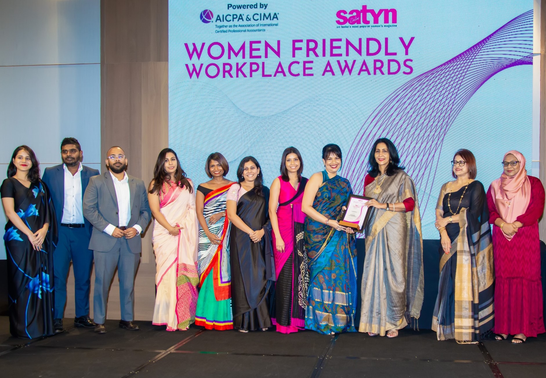 A group of people receiving an award