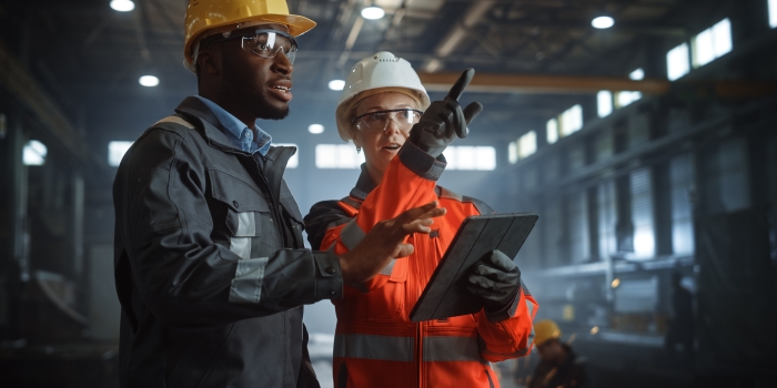 Two workers in conversation 