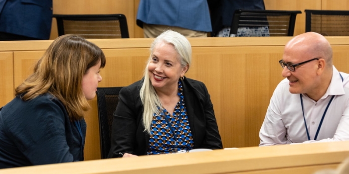 Individuals in disucssion during a convening