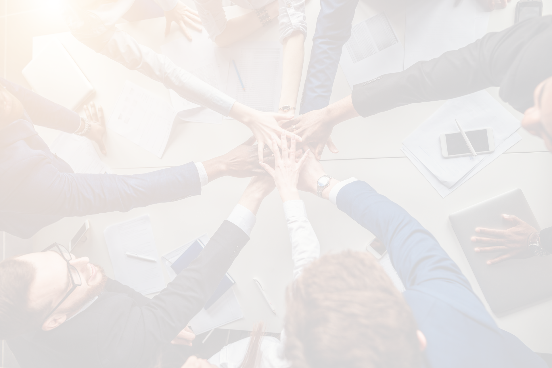 group putting hands in middle