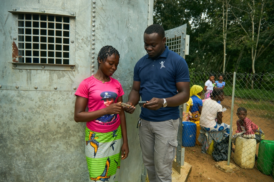 Woman and man talking in front of home