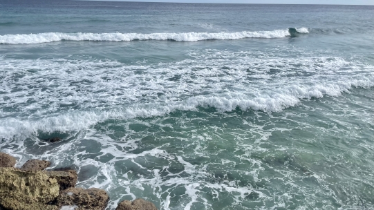 ocean surf crashing on rocks