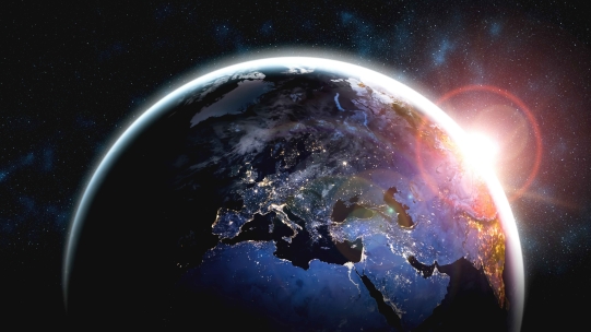 earth from space with sun shinning through