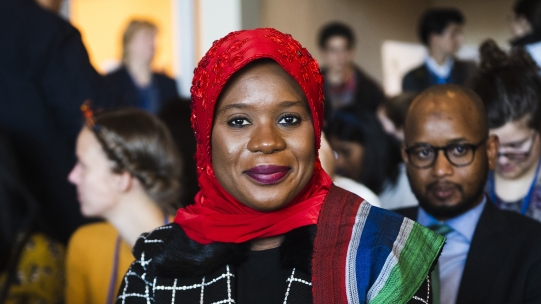 Woman sitting in on a conference