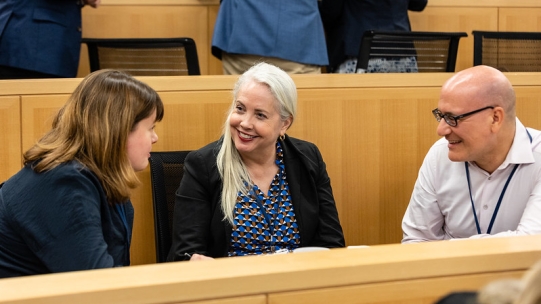 Individuals in disucssion during a convening